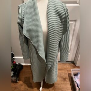 Cardigan-midi length. BB Dakota Very comfortable&warm. Great for days in 50s.